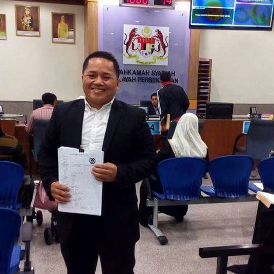 Handout photo of Mark receiving orders from the Syariah Court in Selangor last year.
