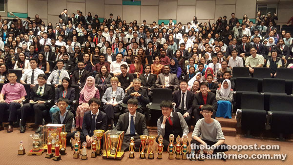 St Joseph debaters (front) with other participants and guests-of-honour after the prize presentation.