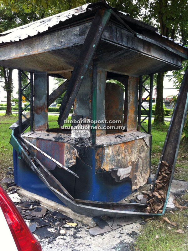 Photo shows the gutted coupon booth at Jalan Simpang Tiga.