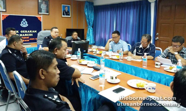 DSP Gabriel Risut ( seated centre) briefing those present at the meeting.