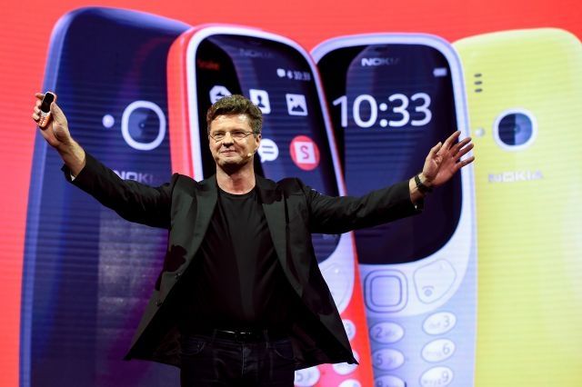 HMD global CEO Arto Nummela presents his company's new phone "Nokia 3310" during a press conference on February 26, 2017 on the eve of the start of the Mobile World Congress. AFP Photo