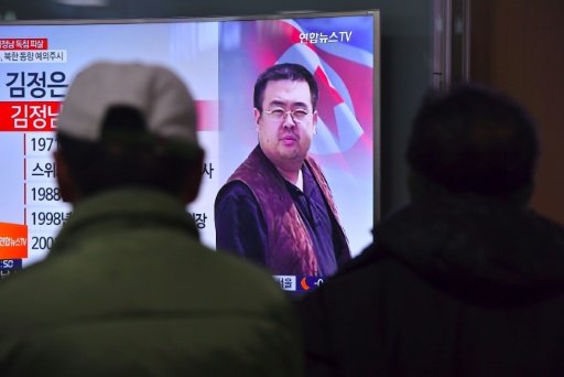 People in a Seoul railway station watch a television news report on the death of Kim Jong-Nam, the half-brother of North Korean leader Kim Jong-Un. - AFP Photo