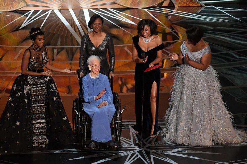 NASA physicist Katherine Johnson (C), whose likeness is set to be made into a Lego, is surrounded by Hidden Figures actresses Janelle Monae (L), Taraji P. Henson (2ndR) and Octavia Spencer (R) as they present on stage at the Oscars Feb 26, 2017. AFP Photo