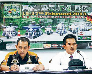 Rosmadee Hj Md Daud (R), Acting Deputy Director of Youth and Sports; and Abd Malek Hamdani (L), Director of Harley Owners Group Brunei Chapter (HOGB 03); during the press conference for the Konvoi Kenali Negara Kitani 2013 at the Indoor stadium at the Hassanal Bolkiah National Sports Complex, Berakas, yesterday. Picture: BT/Saifulizam