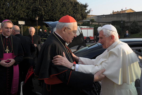 ALL THE BEST: Benedict (right) saluting the Dean of the College of Cardinals, Italian Cardinal Angelo Sodano. — AFP photo