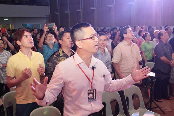 SING ALONG: The audience joining in the singing at the concert. 