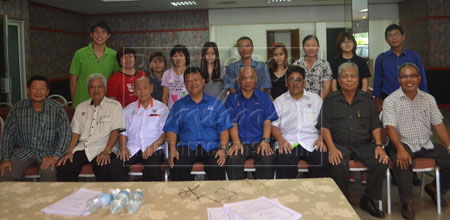 SUPPORTING EDUCATION: Nanta (seated fourth left) is seen with the students and their parents as well as community leaders. 