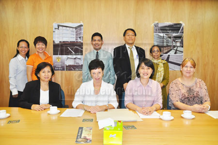 ALL SET: Dr Sue (seated second left) together with McClymont (seated far right), Lau (seated second right) and the team from Woodlands International School at the press conference.