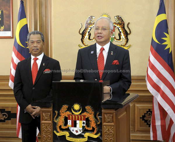 EAGERLY AWAITED ANNOUNCEMENT: Najib announces the dissolution of the 12th Dewan Rakyat to give way to the 13th General Election at Putra Perdana building yesterday.  Also present is Deputy Prime Minister Tan Sri Muhyiddin Yassin. — Bernama photo