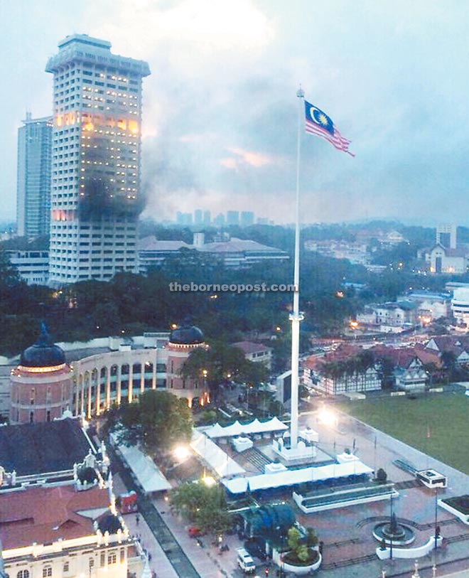 Smoke billowing from Tower Two Bukit Aman during the height of the fire.