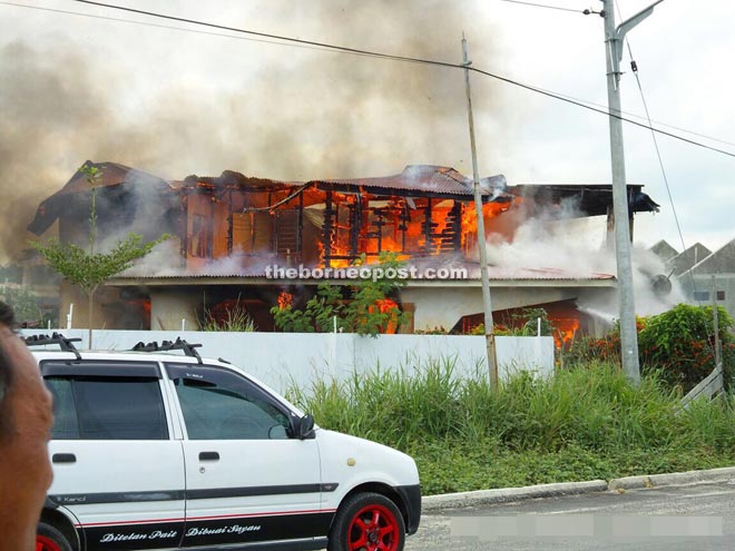 The house engulfed in flames.