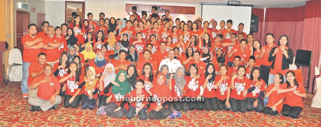 Justine (seated sixth left) and Jonathan (seventh left) in a photo call with the 82 camp participants.