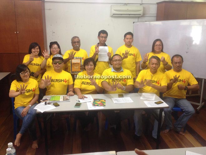 Jannie (seated third left), Wong Tack (seated second right) and other members of the Bersih4 Sabah committee yesterday. 