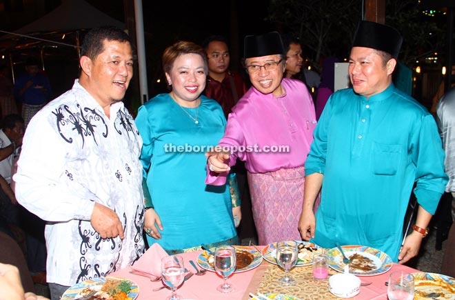 Abang Johari (third left) mingles with guests at the Hari Raya gathering. — Photo by Chimon Upon 