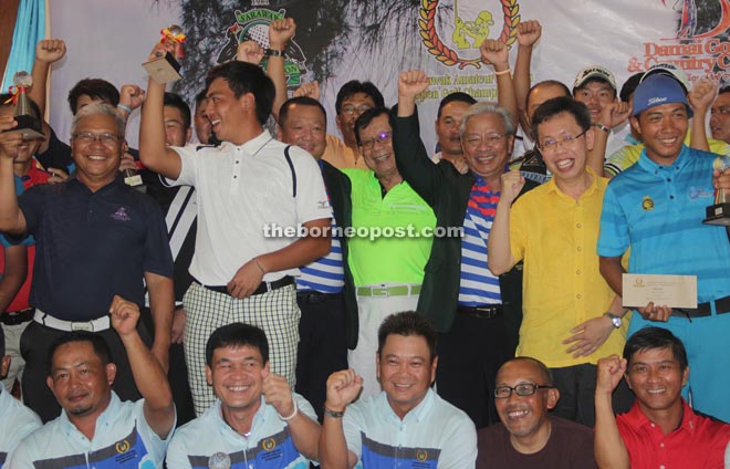 Masing (third right, second row), joined by Dr Sim (second right) and Dr Chan (fourth right), in a group photograph with the 36 qualifiers for the main tournament.