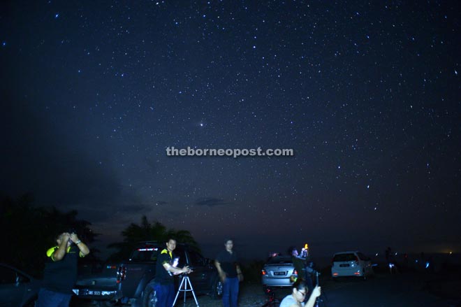 Photographers star gazing with their DSLR.