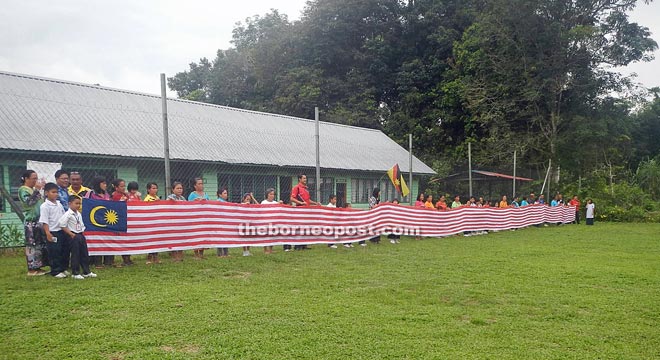 The 30 metre long flag created by the school community of SK Nanga Menalun.   