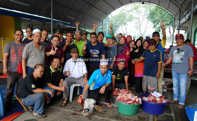 Some of the RPR Kidurong residents involved in the gotong-royong are seen with part of the sacrificial meat. 