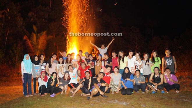 The hospitality students gather for a group photo during the campfire session.