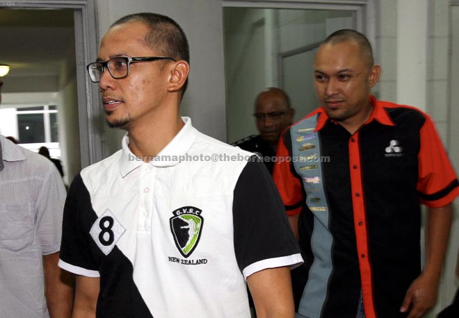 Nudzul Haqimi (right) and Mohd Ridzuan arriving at the magistrate’s court.— Bernama photo