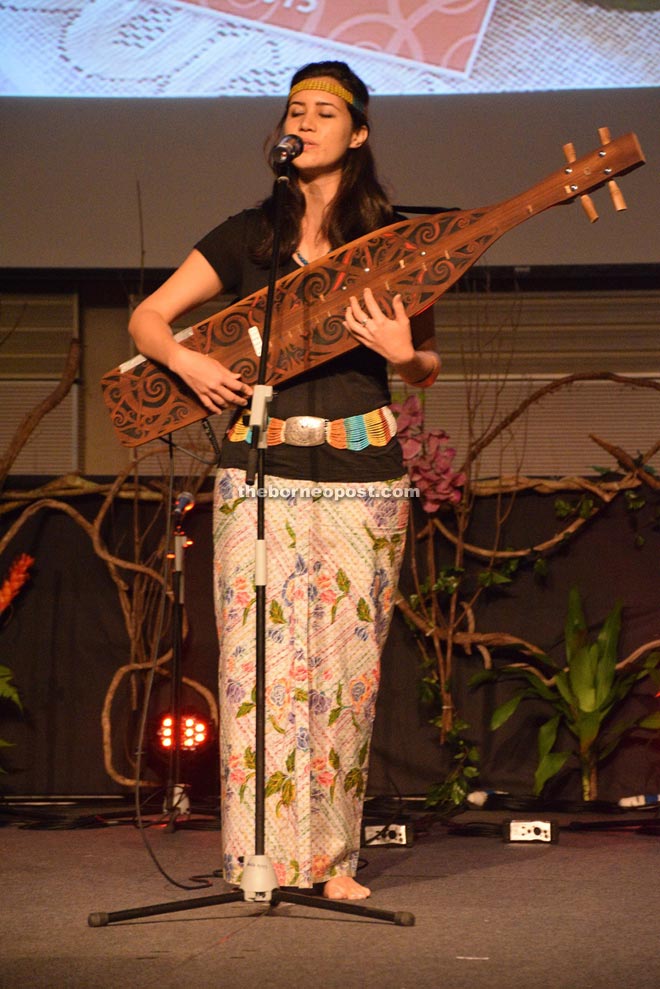 Sape player Alena Murang performing during the gala dinner.