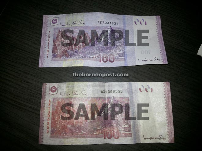 Comparing the genuine note (above) with the fake one.  