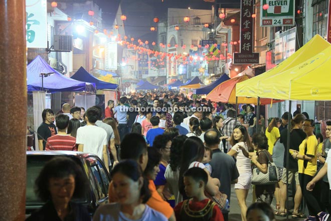 People throng Carpenter Street nightly during the Kuching Inter-Cultural Mooncake Festival 2015.