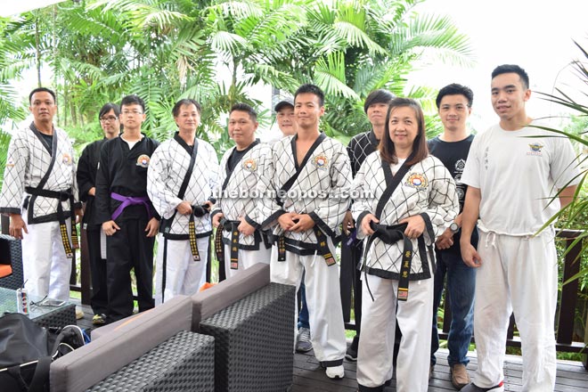 Jong (fourth left) and his students at Sarawak Club.