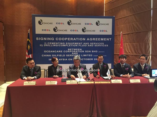 Nelson (third left) at the signing ceremony.