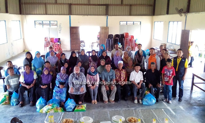 Rosey (front sixth left) with the villagers and aid recipients.