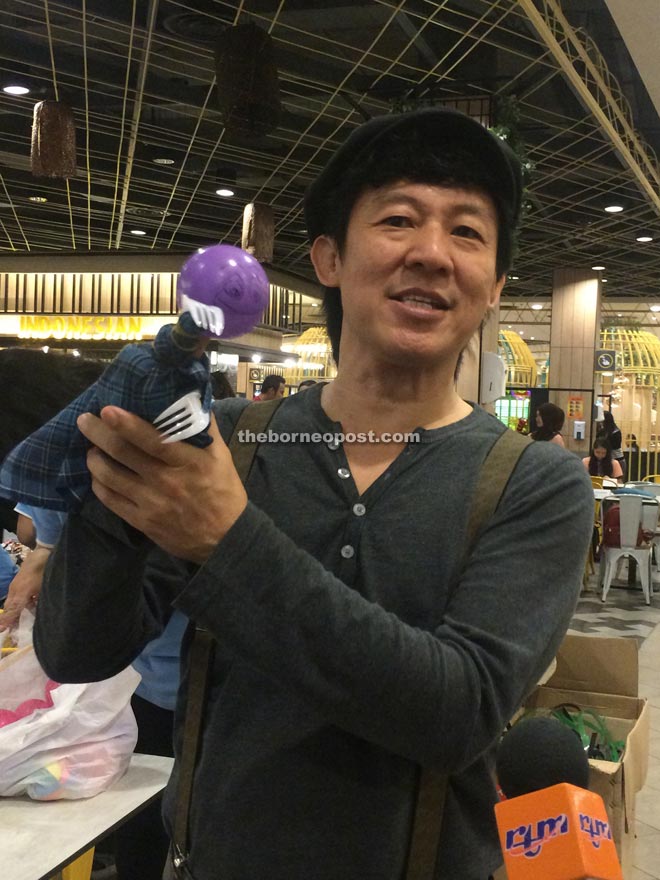 Yeo with a simple puppet that he created to show reporters how simple it is to make one. 