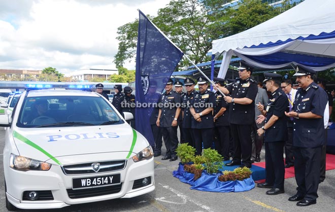 Sabtu symbolically flags off the first batch of new patrol vehicles yesterday.