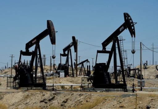 © AFP/File | Oil pumping jacks are pictured at the Chevron section of the Kern River Oil Field near Bakersfield, California on June 24, 2015 