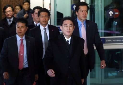 Japanese Foreign Minister Fumio Kishida (centre) arrives at Gimpo airport in Seoul on December 28, 2015. -AFP Photo