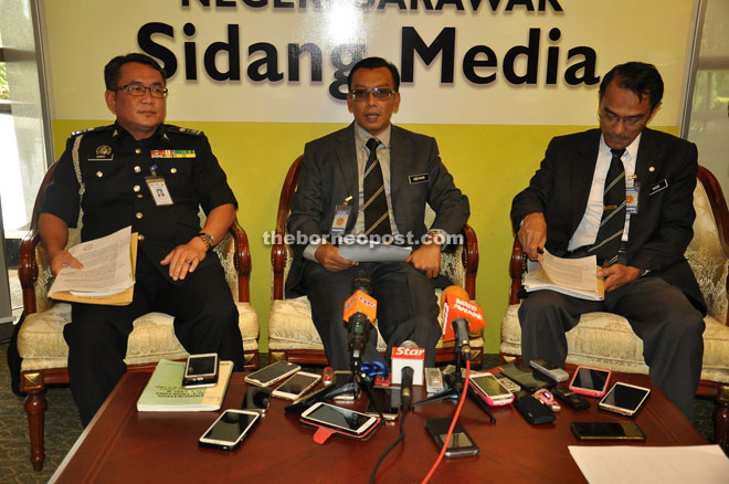 Mohd Zulfikar (centre) speaking to reporters during a press conference at the State Legislative Assembly Complex yesterday. Also seen are state Immigration Department enforcement chief Garry Belayong John Sikie (left) and head of communications and corporate unit Kadir Sapian. 