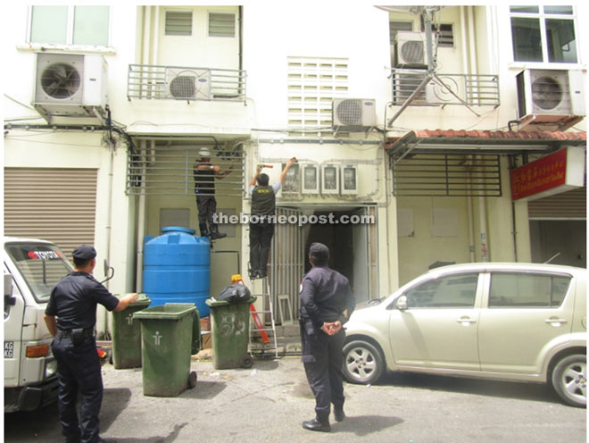 Sesco inspection team members dismantling an illegal connection at the premises.