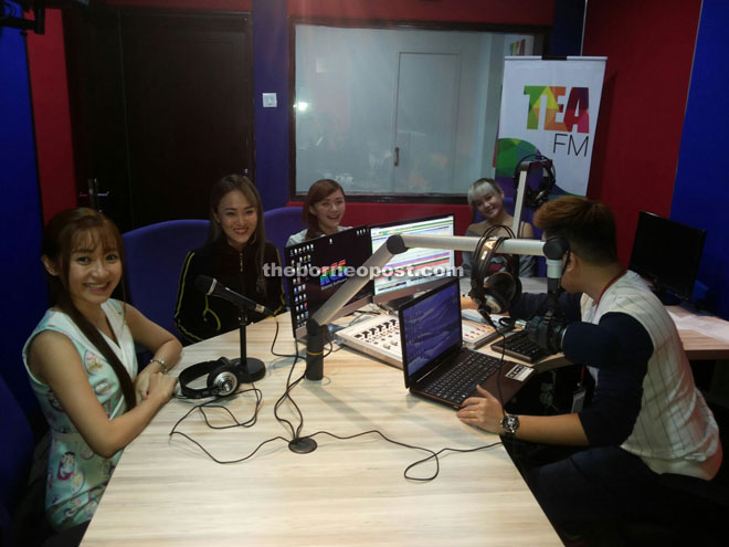 The girls are being interviewed at Tea FM.