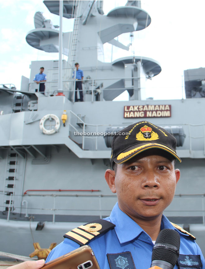 Rozlysham speaks to reporters outside the ship. — Photos by Chimon Upon