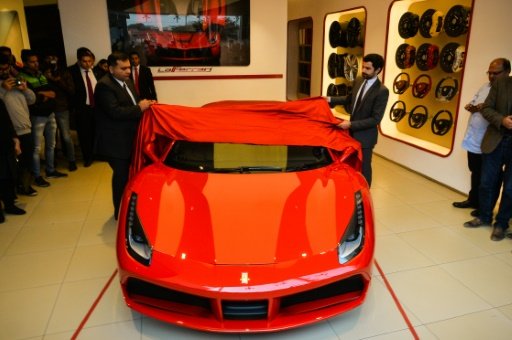 AFP/File | US financier George Soros has acquired a $40 mn stake in Ferrari 