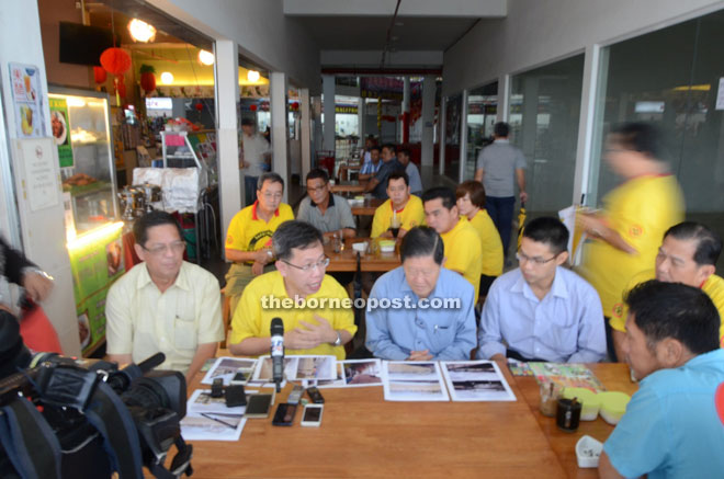 Dr Sim (second left) chairs a press conference at Genesis Parade Sungai Moyan shopping mall.