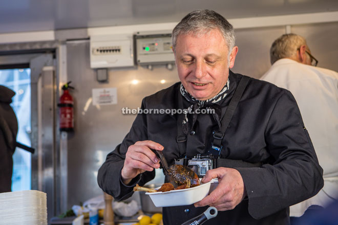 Martin with one of his European finger food dish cooked with Malaysian palm oil.