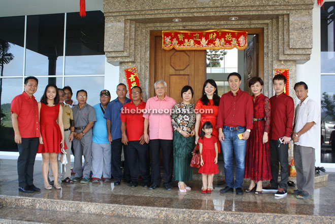 Larry (fourth right) with well-wishers at his open house.