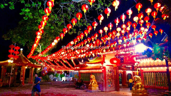 The red lanterns hang over the main entrance of the temple.