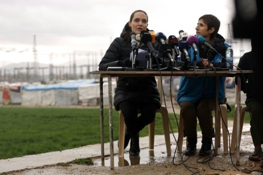 AFP | Special envoy of the UN High Commissioner for Refugees, US actress Angelina Jolie speaks during a press conference under the rain as part of her visit at a Syrian refugee camp near the city of Zahle in Lebanon's Bekaa Valley on March 15, 2016 