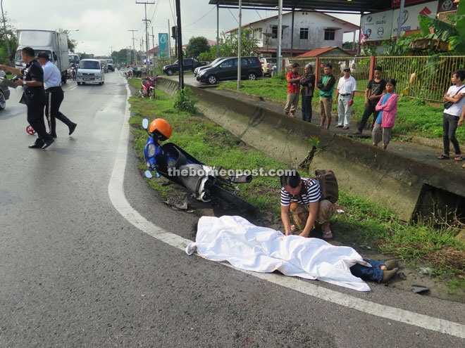 A family member attends to the victim.