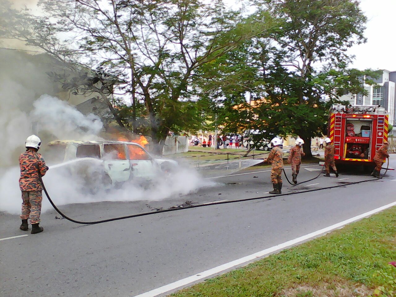 Firefighters begin to control the fire.