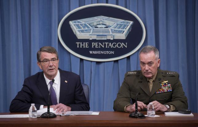 U.S. Secretary of Defense Ash Carter (L) and Chairman of the Joint Chiefs of Staff Gen. Joseph Dunford speak to press about counter-ISIL operations at the Pentagon, in Washington March 25, 2016.  REUTERS/Department of Defense/Navy Petty Officer 1st Class Tim D. Godbee/Handout via Reuters