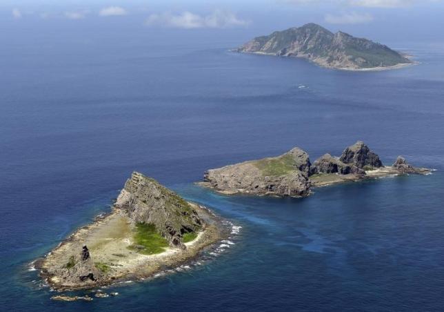 A group of disputed islands, Uotsuri island (top), Minamikojima (bottom) and Kitakojima, known as Senkaku in Japan and Diaoyu in China is seen in the East China Sea, in this photo taken by Kyodo September 2012. REUTERS/Kyodo