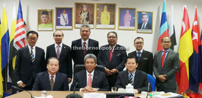 Ahmad (seated centre) with Rubin (left) and Au Kam Wah after the meeting. Also seen (standing from left) are Bernard, Peter Thien, Charles, Zaaba, Shaifuddin and Ramlee.