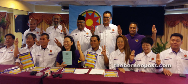 Soo (seated fourth left) with the 12 candidates at the press conference.